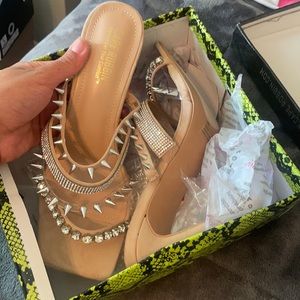 Nude spiked heels